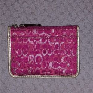 Coach pink change purse.